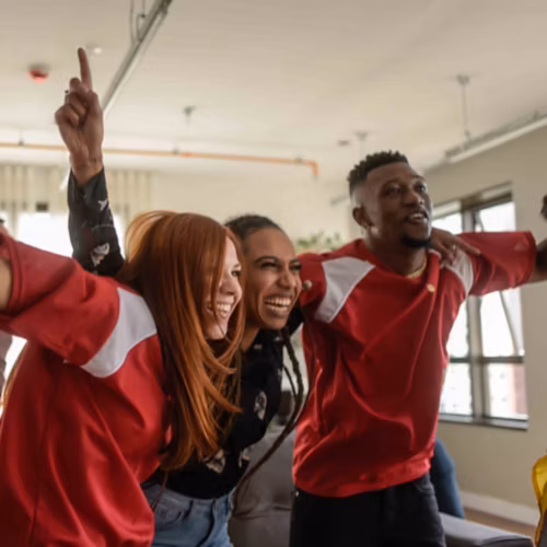 Friends cheering on their favorite team