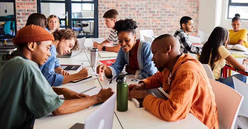 Group of people collaborating around a table