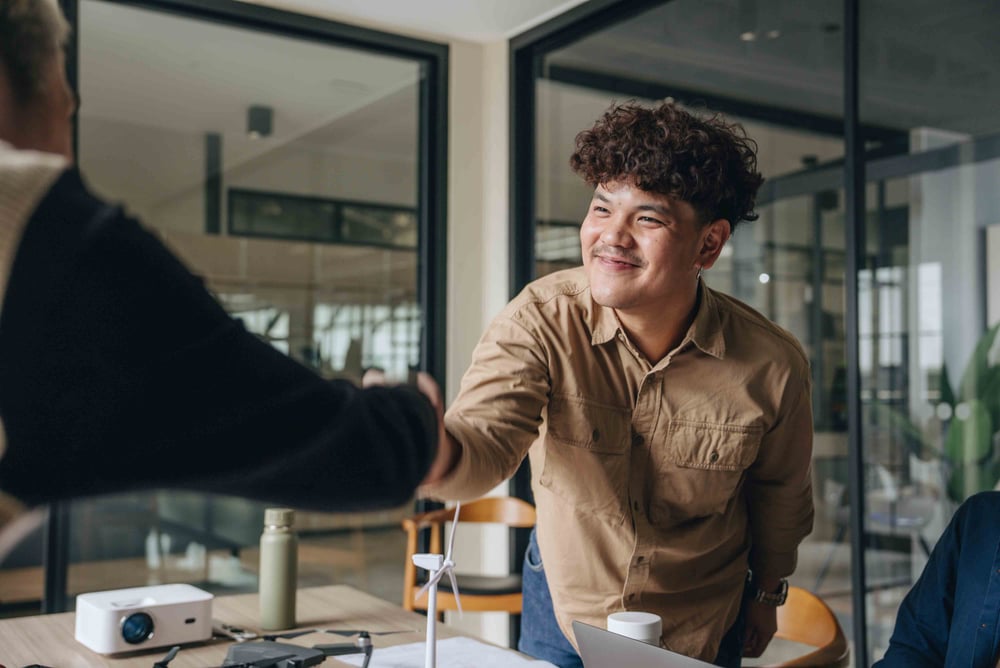 People shaking hands and smiling