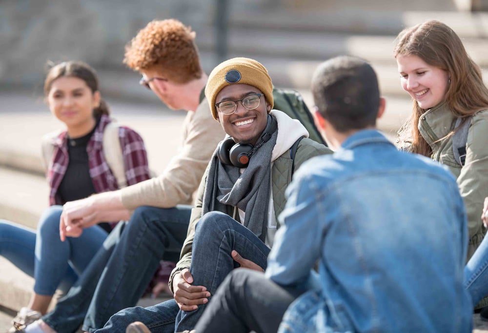 Students sitting outside talking