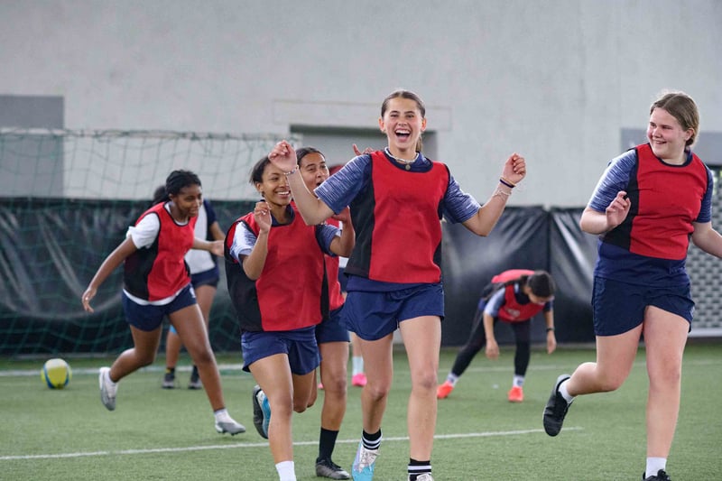 People playing soccer and celebrating