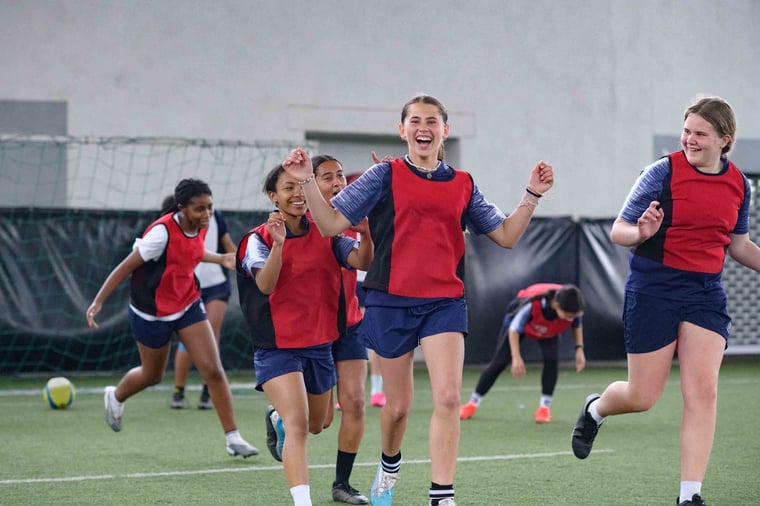 People playing soccer and celebrating