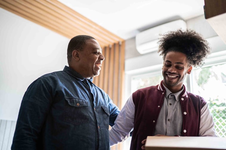 Parent and student smiling together