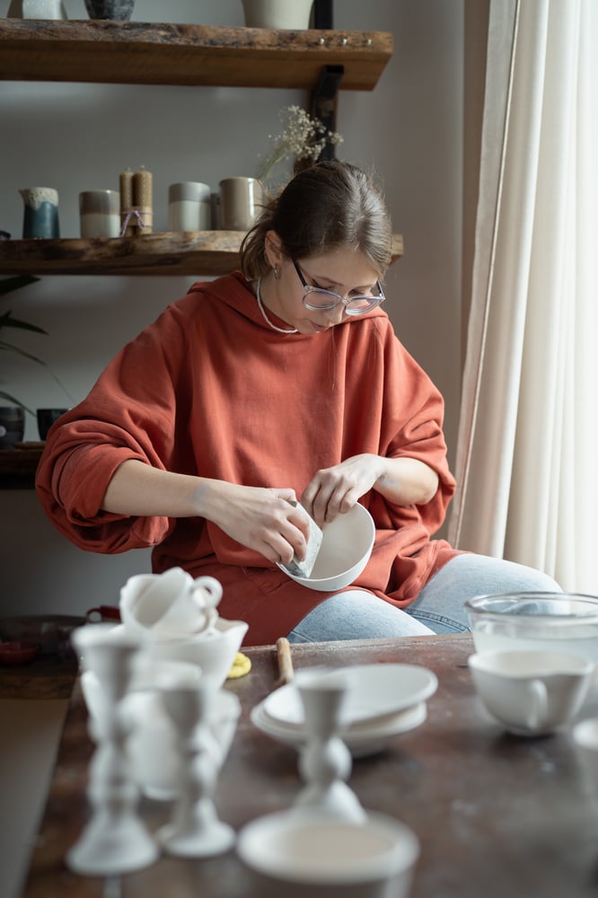 Person doing pottery