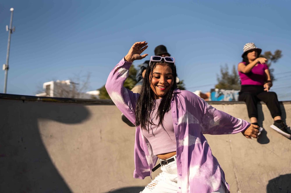 Person smiling and dancing