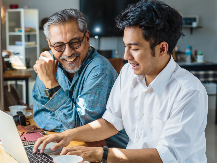 student and dad working on the computer